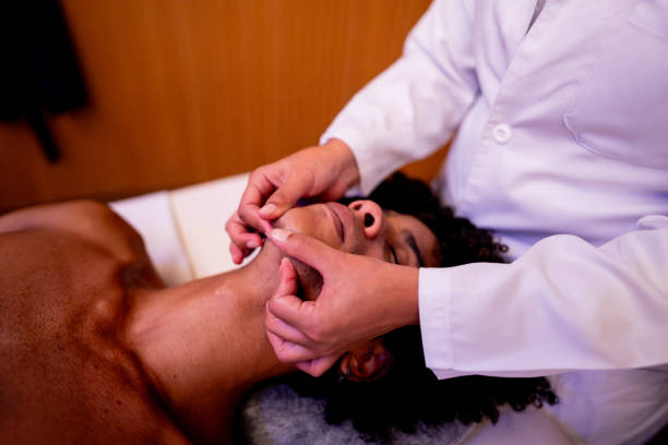 istock Young man receiving massage at spa 2158715273