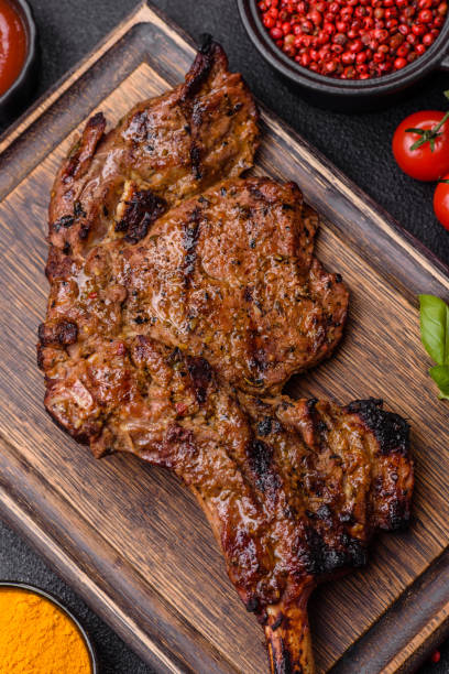 istock Juicy beef tomahawk steak on the bone baked on the grill 2158716804