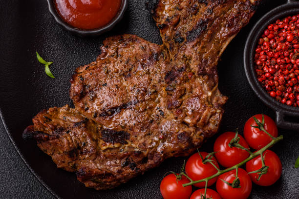 istock Juicy beef tomahawk steak on the bone baked on the grill 2158716831