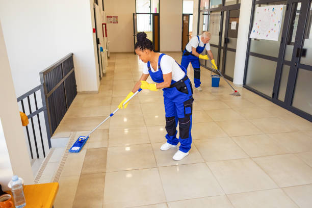 istock Janitors in blue Uniform cleaning the school floor 2158718788