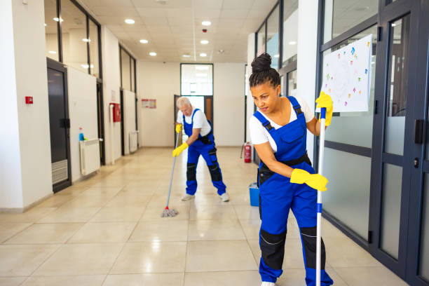 istock Janitors in blue Uniform cleaning the school floor 2158719472