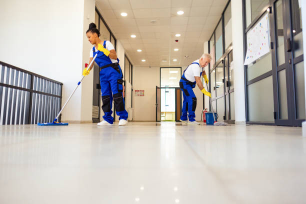 istock Janitors in blue Uniform cleaning the school floor 2158719523