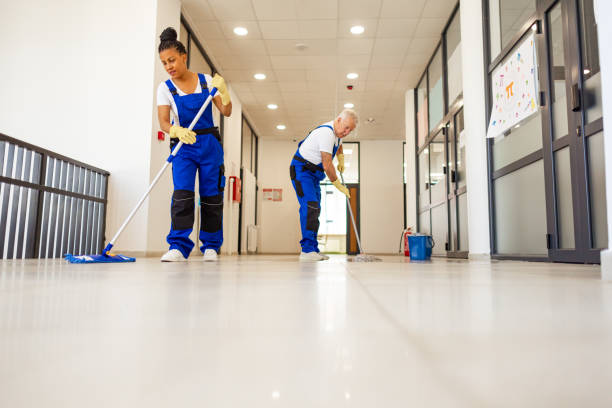 istock Janitors in blue Uniform cleaning the school floor 2158719591
