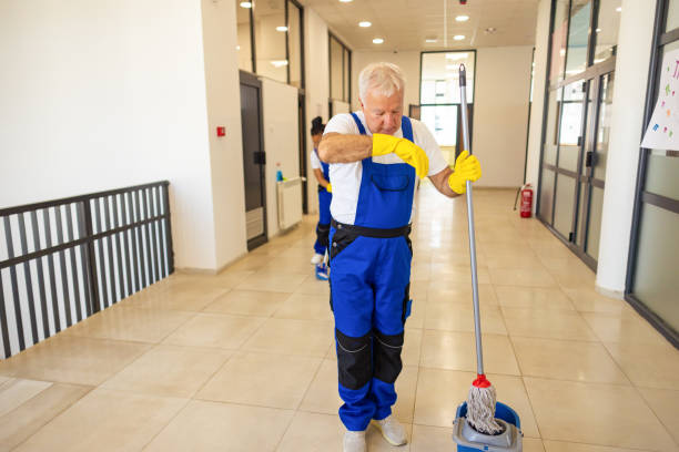 istock Janitors in blue Uniform cleaning the school floor 2158719712