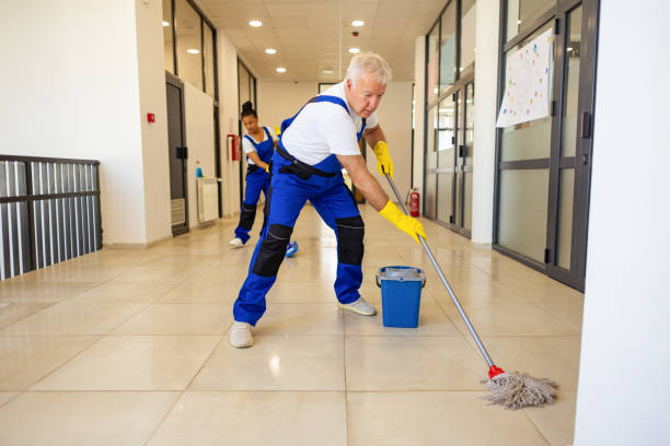 istock Janitors in blue Uniform cleaning the school floor 2158719781