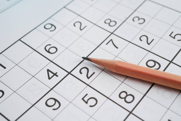 istock Sudoku puzzle, game to play for keep you brain younger for developing Alzheimer disease in senior patient. 2158722518