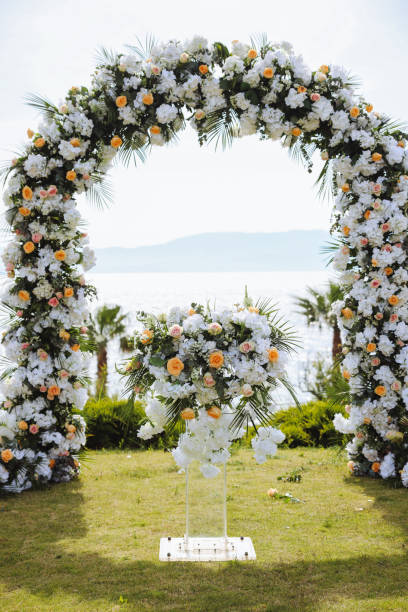 istock Beautiful wedding arch on the beach 2158725412