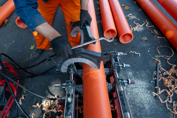 istock An engineering worker is repairing a pipeline by the city road 2158727768