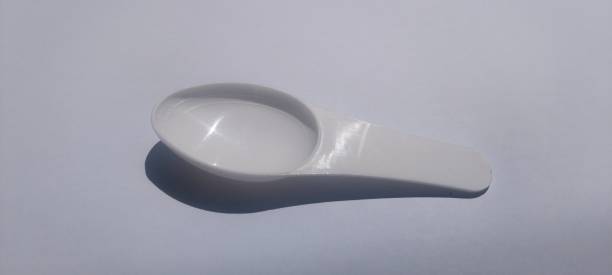 istock Measuring spoon for syrup medicine, white spoon 2158728888