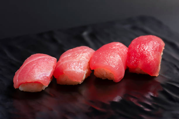 istock Tuna Sushi on Black Plate 2158729725