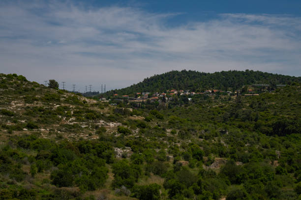 A village in the judea mountains, Israel, on a partially cloudy spring day.