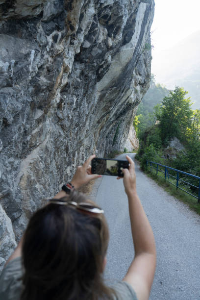 istock Woman photographing canyon 2158732704