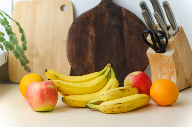 Set of different fruits on table. Ripe juicy fruits lie on the table.