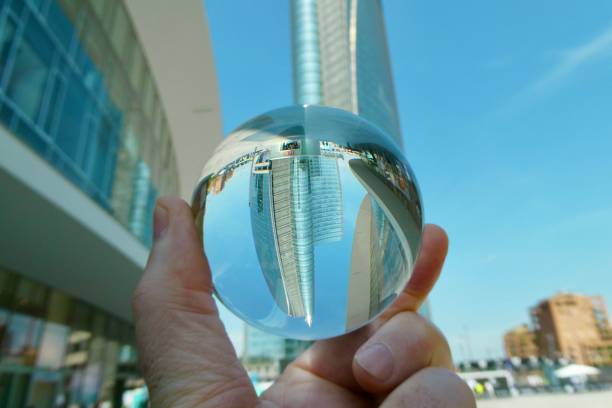 istock Hand holding crystal ball against skyscraper 2158734227