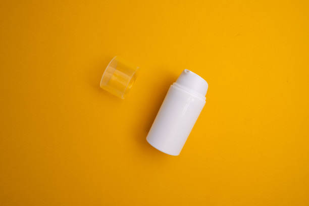 istock Container for cream, shampoo, toiletries, spa. Unbranded white plastic bottles. Bottle with a dispenser for cosmetic products. Skin care and beauty concept. Mockup style, copy space 2158735265