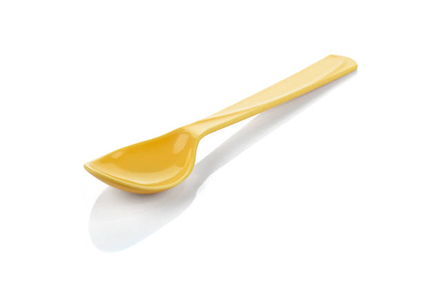 istock Yellow plastic spoon isolated on white isolated background with clipping path. 2158738070
