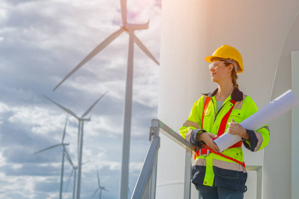 istock professional engineers working service maintenance wind turbines. Clean energy for future. Alternative eco natural power generator worker people concept 2158738737