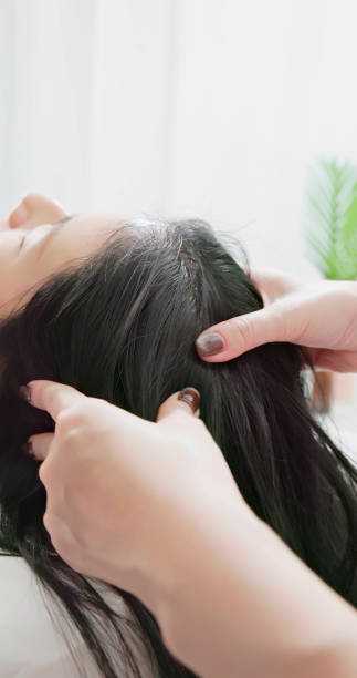 istock asian masseurs massage client head 2158743260