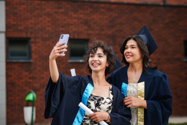 istock Graduating young women are taking selfies for memories. 2158744814