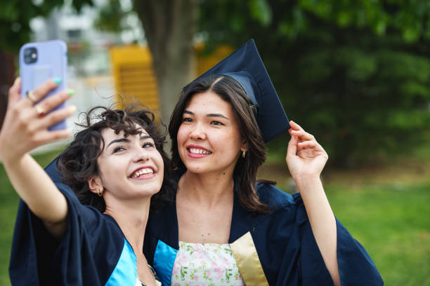 istock Graduating young women are taking selfies for memories. 2158745267