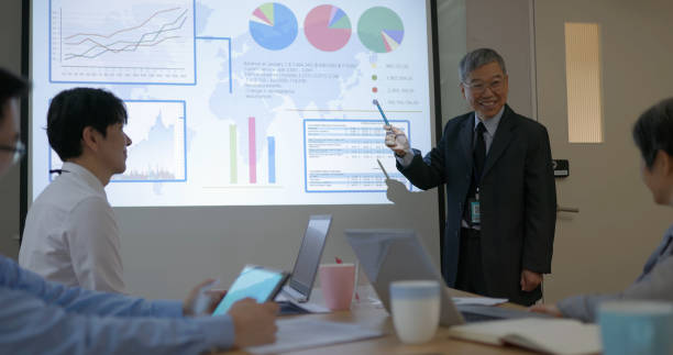 istock senior executive businessman do presentation 2158747819