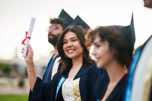 istock Graduating people are in line at the ceremony in campus. 2158748024