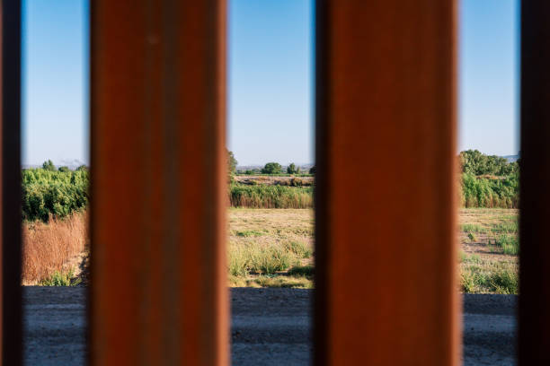 istock A view through the U.S. Border Wall Fence into Mexico 2158750992