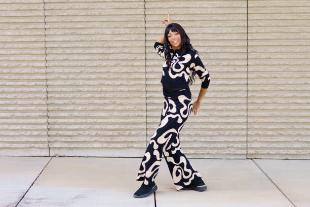 istock Confident modern freestyle dancer acting in the street 2158753923