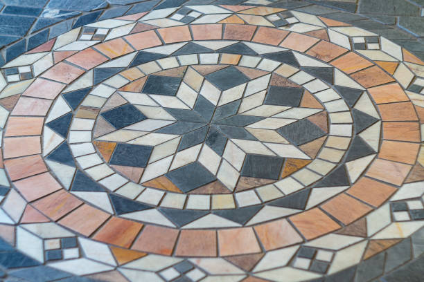 istock Small multi-colored floor tiles from which the eight-pointed star flower is assembled, which is of great importance in Islamic culture and religion. Well-known world sacred symbols. 2158754954