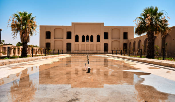 istock Adobe pavilion reflection over water pool and in Dowlatabad Garden 2158758396