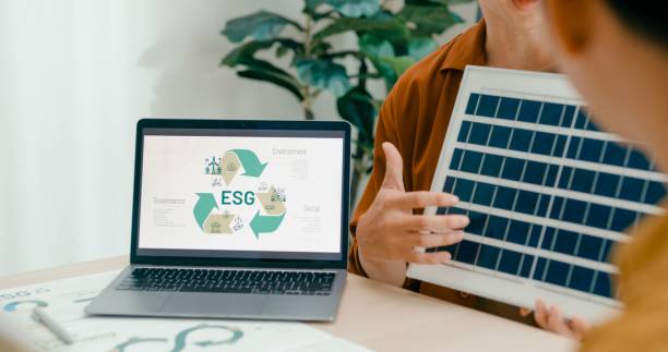 istock Closeup of diverse team collaborates on renewable energy solutions, with a focus on solar panel technology and sustainable business practices. Eco-Friendly Business Team Discussing ESG Goals. 2158761611