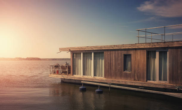 istock A houseboat on a lake at sunset. 2158761802