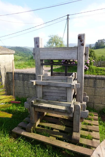 istock traditional cider press to press apples and make cider. antique tools 2158762834