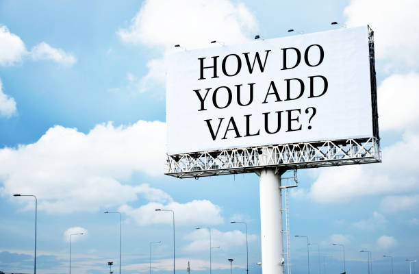 istock How do you add value? text message on signboard with blue sky 2158765296