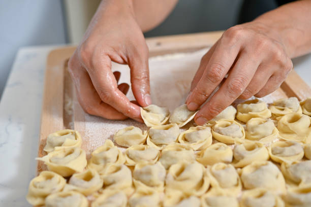 istock Female hands making Turkish food called manti 2158766394