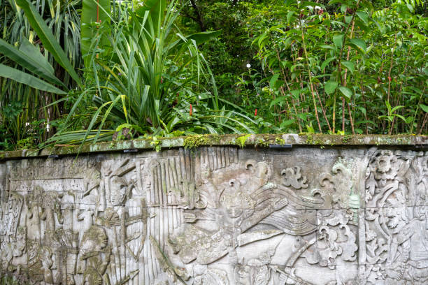 Singapore, Singapore - April 3, 2024. Historic carvings on wall along the trail in Fort Canning Park in Singapore