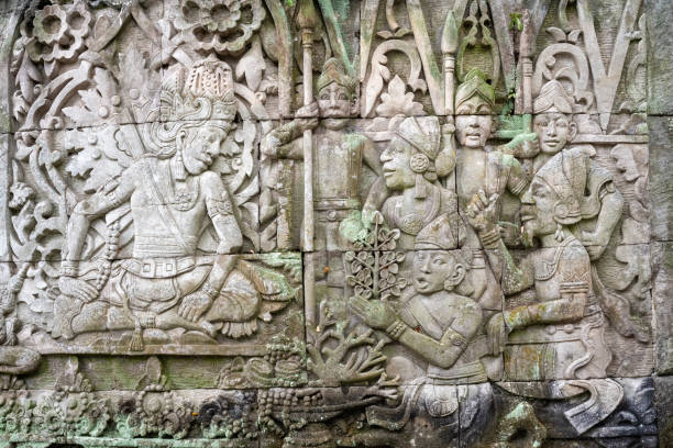 Domestic Life on Bayon Temple at Angkor Thom in Siem Reap Province, Cambodia. This is a carving on Bayon Temple, built in the late 12th to early 13th century as the state temple of King Jayavarman VII.