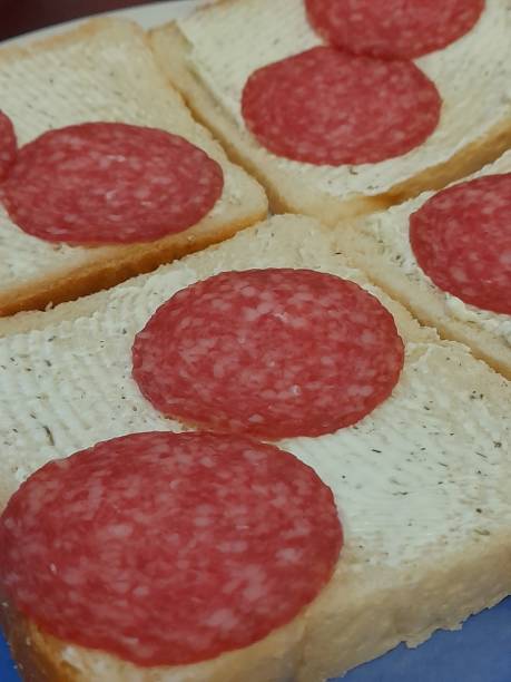 istock Sandwich with bread, butter and salami 2158768354