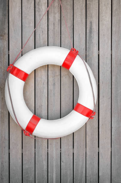 A lifebuoy on a wooden wall.