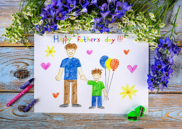 Father s day concept Children's drawing: father and son holding hands. A bouquet of wild flowers as a decoration