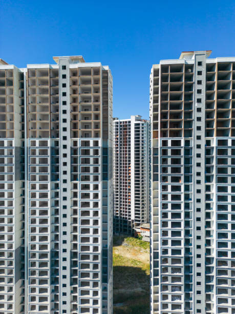 istock Construction of Unfinished Modern Apartment Buildings 2158776115