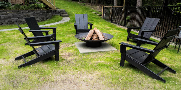 istock fire ring burning pit with chairs (outdoor firewood burn) campfire unlit country home camping recreation outdoors cooking outside 2158779937