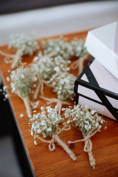 istock Roses boutonnieres on a wooden table 2158781502