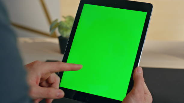 istock Guy finger touching chromakey tablet display starting lesson at home zoom on 2158783258