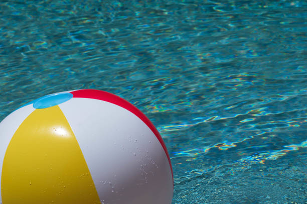 Colorful inflatable ball floating in swimming pool