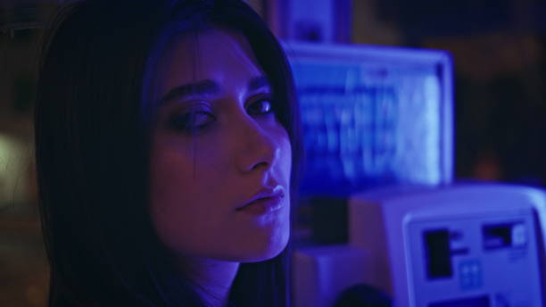 istock Depressed model posing neon light call box closeup. Unhappy woman looking camera 2158788106