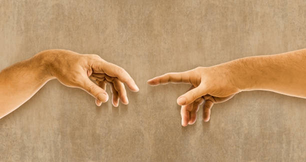 istock Two hands Michelangelo the creation of Adam 2158788839