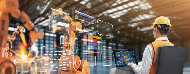 istock Technician or engineer work with robotic arms in factory 2158790650