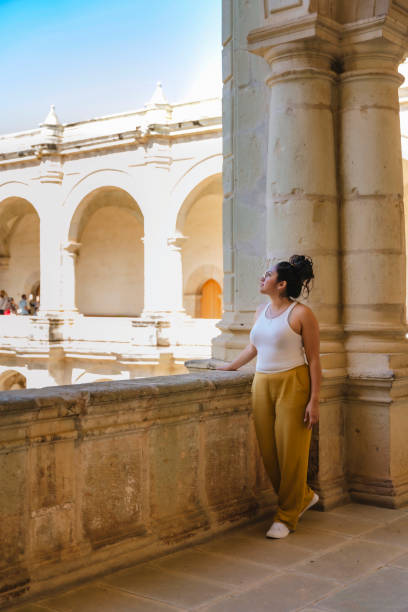 istock Young Latina admiring historic arches 2158791236