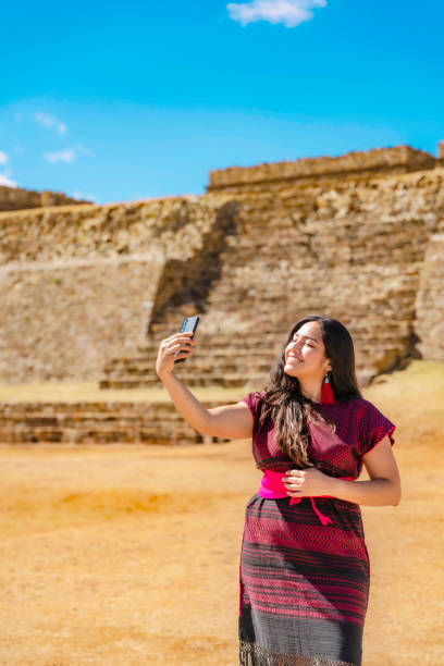 istock Latina Woman Documenting Monte Alban Visit 2158791282